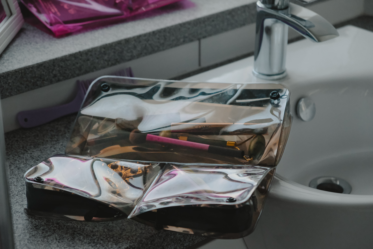 DivideNPac smoky quartz packing pouches in use - organized travel storage with compartments