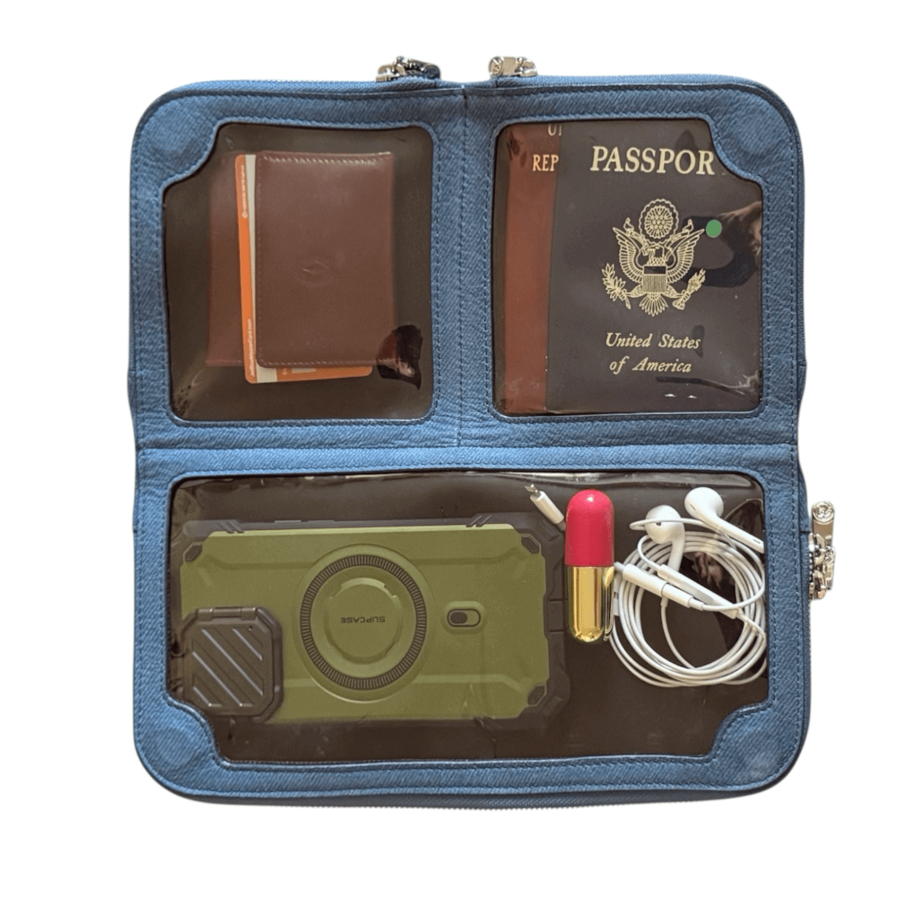 House of Alimena denim blue crossbody bag open showing organized compartments - luxury leather with travel essentials