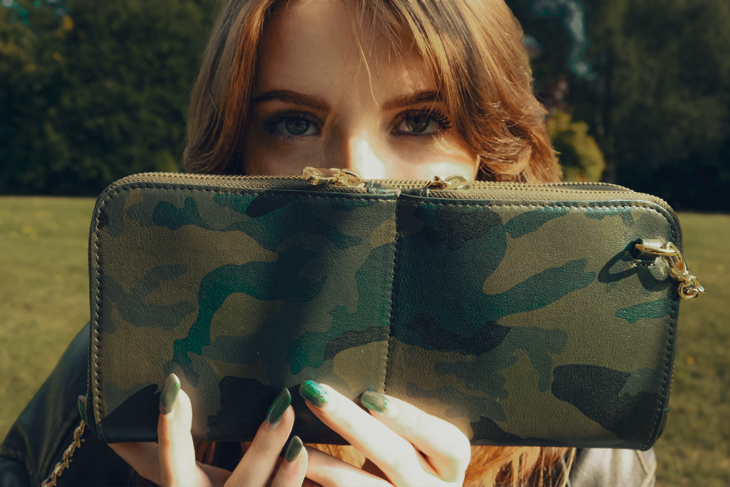 House of Alimena green camo leather sling bag lifestyle shot - luxury leather handbag with organized compartments